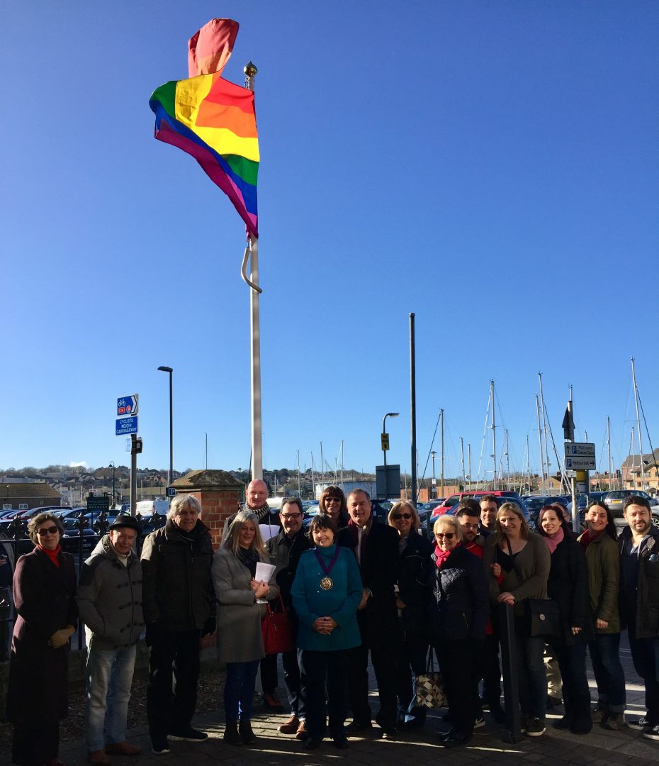 Photo of people with the rainbow flag at the council's Commercial Road offices