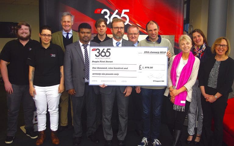 Richard Drax MP hands over charity cheque