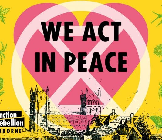 Wimborne’s Role in the International Extinction Rebellion heart with XR logo and minster church