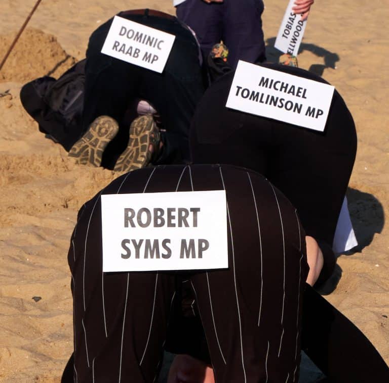 “Dorset MPs” and “cabinet ministers” bury their heads in the sand over climate crisis
