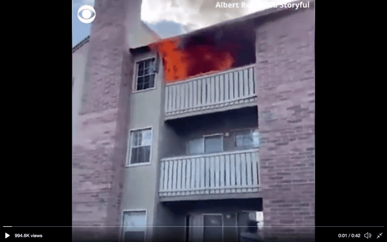 Watch as man saves 3 year old boy as he falls from third story of burning building