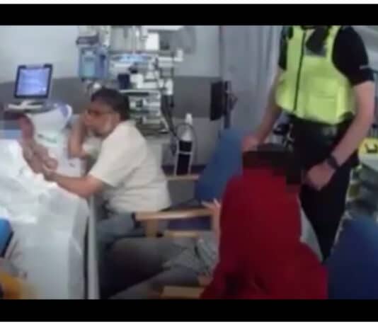 A couple are taking legal action after being dragged away from the hospital bed of their dying daughter by police Father takes legal action against the police