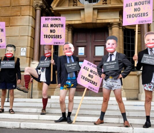 Campaign groups march to demand climate action after 2 years of council delay