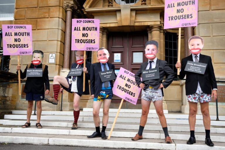 Campaign groups march to demand climate action after 2 years of council delay