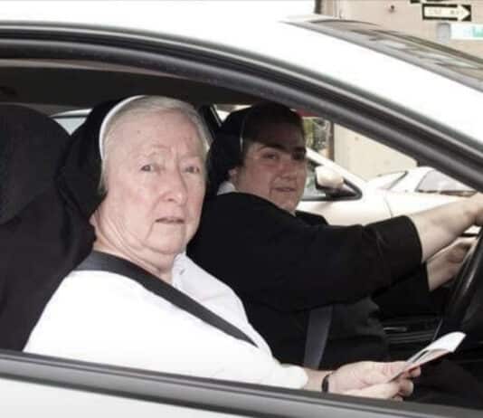 A car load of drunks pulls up next to some nuns at a traffic light