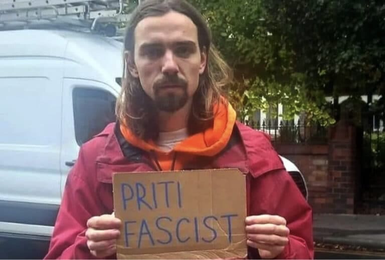 Man who held up ‘Priti Fascist’ sign paid compensation by police