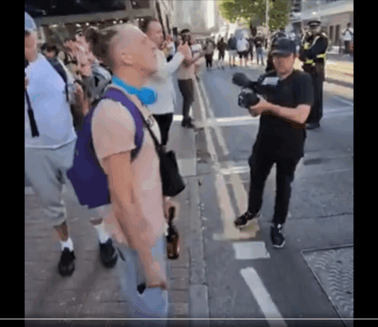 A Blind Man in a Wheelchair and a Ninety Year Old are Arrested While This Piece of Trash Gets to Shout This